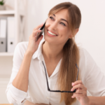 happy-office-girl-talking-on-mobile-phone-sitting-EENY5A2.png
