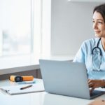 charming-female-doctor-using-laptop-in-clinic-2021-09-04-14-20-31-utc (1)