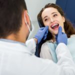 selective-focus-of-cheerful-woman-in-braces-openin-2022-02-05-12-54-54-utc (2)
