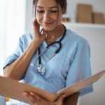 nice-female-doctor-studying-documents-in-clinic-2021-09-04-14-29-35-utc (1)